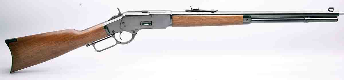 This M73 short rifle (circa 2015) with a 20-inch barrel is a reproduction manufactured in Miroku, Japan.  This M73 carbine features early model sights and raised ridges on either side of the receiver to accommodate  the dust cover. The flat – front to back – receiver ring indicates it is chambered for .44 WCF.